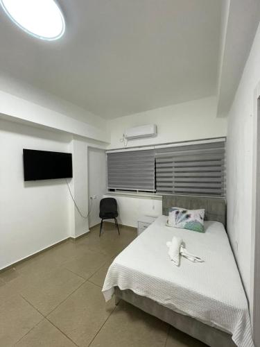 Ένα ή περισσότερα κρεβάτια σε δωμάτιο στο Laila's studio2