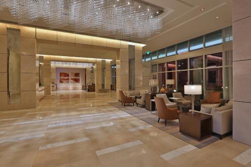 a lobby of a hotel with a chandelier at InterContinental Real Santo Domingo by IHG in Santo Domingo