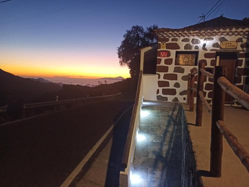 a view of the sunset from the side of a road at Casa Leon in Tejeda
