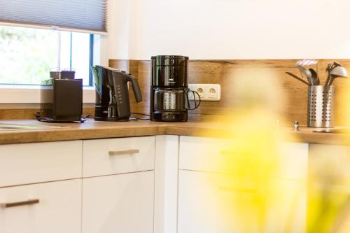 a kitchen with a coffee maker on a counter at Urlaub in Andreasberg in Sankt Andreasberg