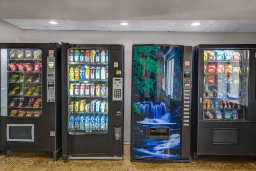 two soda machines in a store with drinks at Motel 6-Norcross, GA in Norcross