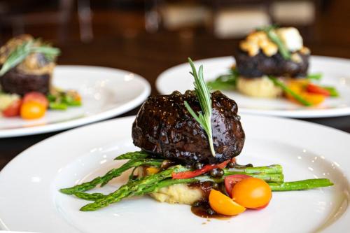 a plate of food with vegetables on a table at Swinomish Casino & Lodge in Anacortes