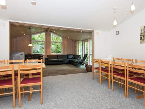 a dining room with a table and chairs at 20 person holiday home in Herning in Herning