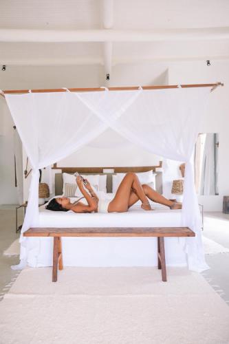 Ένα ή περισσότερα κρεβάτια σε δωμάτιο στο Villa dos Nativos Boutique Hotel