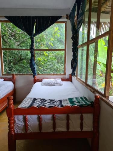 Ein Bett oder Betten in einem Zimmer der Unterkunft Casa Ahau
