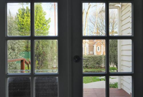 an open window looking out onto a yard at A Coonawarra Experience in Penola