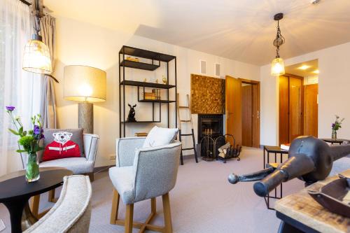 a living room with a couch and a table at Villa Sokol in Borovets