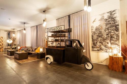 a living room with an old car in the middle at Villa Sokol in Borovets