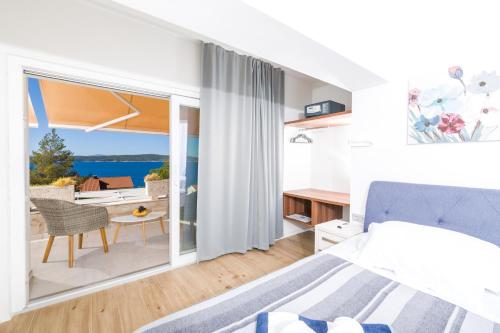 Postel nebo postele na pokoji v ubytování Stella Mare Eco Boutique House