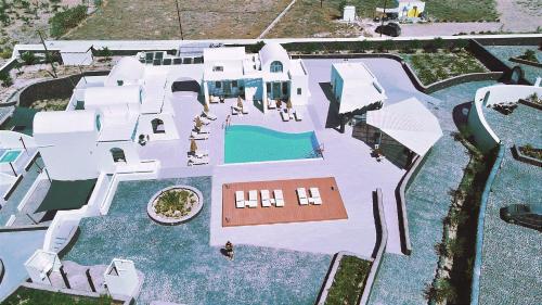 an aerial view of a mansion with a swimming pool at Santa Irina Luxury Sunny Lofts in Perivolos