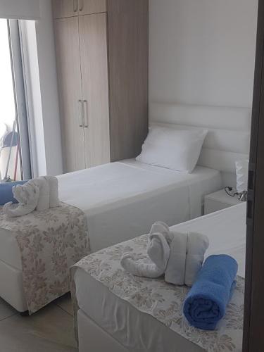 Ένα ή περισσότερα κρεβάτια σε δωμάτιο στο Christopher's Sandy Beach Suites