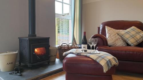 A seating area at Old Farm Holiday Cottages - Scottish Borders 