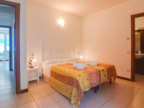 a bedroom with two beds in a room at Bellagio Villas in Lezzeno
