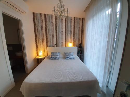 a bedroom with a large bed with blue pillows at Residenza Azzurra in Cattolica