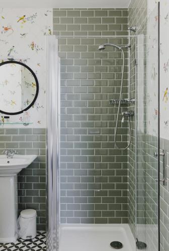 a bathroom with a shower and a sink at The Queens Hotel in Portsmouth