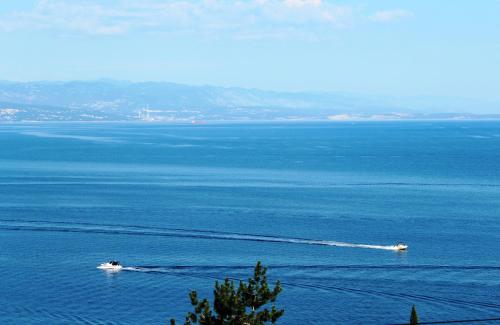 two boats in a large body of water at Apartments Kiki in Opatija