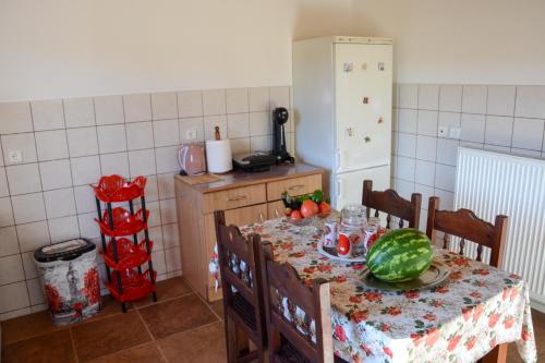 a kitchen with a table with a watermelon on it at Villa Vicky Corfu in Agios Ioannis