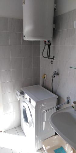 a small bathroom with a toilet and a sink at Apartmán Perspekta 196 in Čatež ob Savi