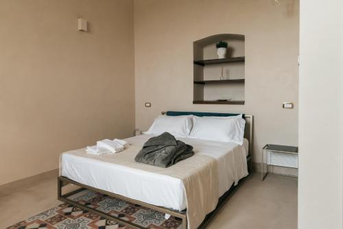 Katil atau katil-katil dalam bilik di Villa Pesce 1820 Residenza d'Epoca & SPA