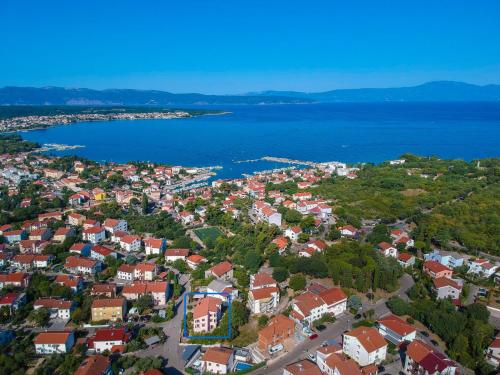 an aerial view of a town next to the water at Apartment Vera - MLK325 by Interhome in Malinska