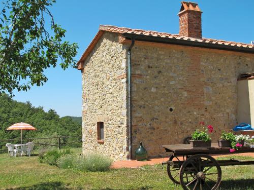 a stone building with a picnic table in front of it at Apartment Pian dei Carpini - Laura by Interhome in Prata