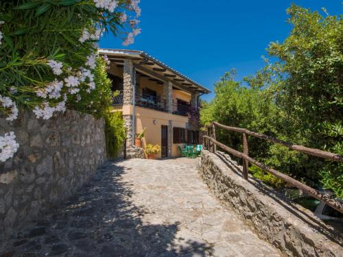 a house with a pathway leading up to it at Villa Von Salis by Interhome in Ansedónia