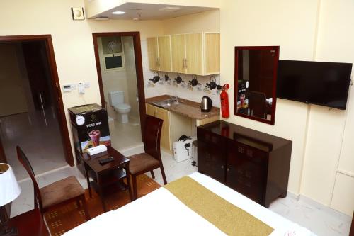 Kuchyň nebo kuchyňský kout v ubytování Onyx Hotel Apartments - MAHA HOSPITALITY GROUP
