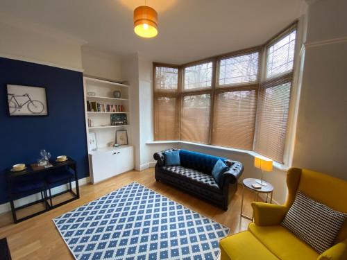 a living room with a couch and a rug at Stylish Apartment With Secure Parking Close to City in Chester