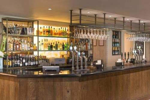 a bar with a lot of bottles of alcohol at Forest in Burnley