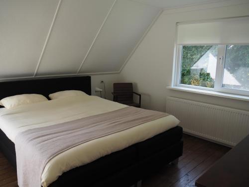 Una cama o camas en una habitación de Reggezicht; Mooi huis op een prachtige plek!