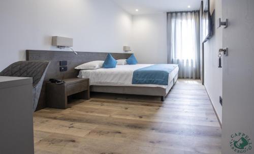 Postel nebo postele na pokoji v ubytování Albergo Cappello e Cadore