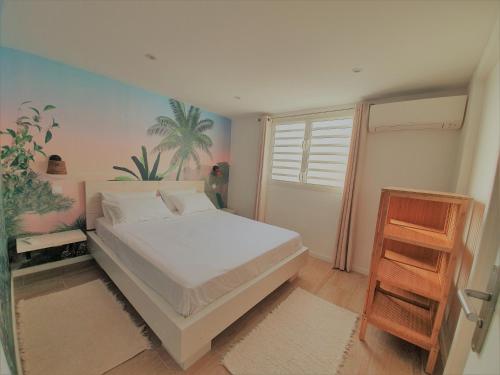 Rúm í herbergi á Kozycoco - Suite Coco - votre séjour tropical au calme