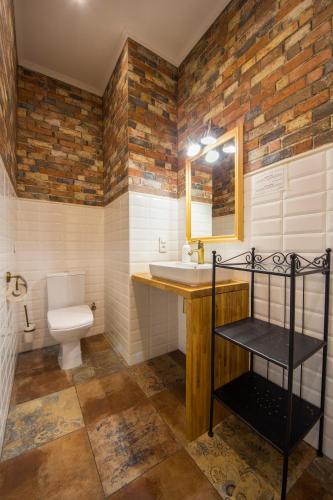 a bathroom with a sink and a toilet at Central Dayflat Apartments in Kyiv
