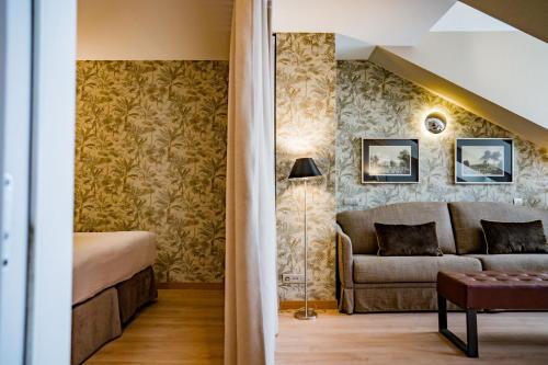 Ένα ή περισσότερα κρεβάτια σε δωμάτιο στο Hotel Meninas - Boutique Opera