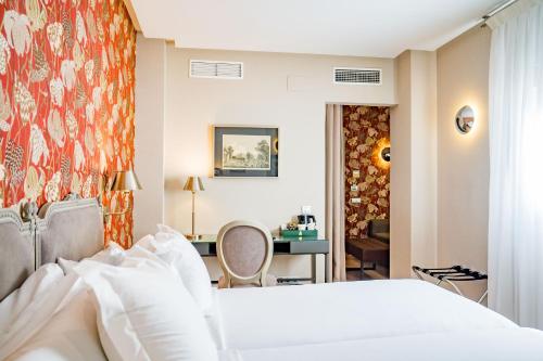 Ένα ή περισσότερα κρεβάτια σε δωμάτιο στο Hotel Meninas - Boutique Opera