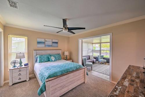 a bedroom with a bed and a ceiling fan at Waterfront Lake Placid Escape with Dock and Lanai in Lake Placid