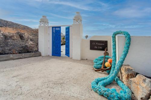 a large blue rope sitting in front of a door at Etti Paradise Suite Mediterraneo in Pájara