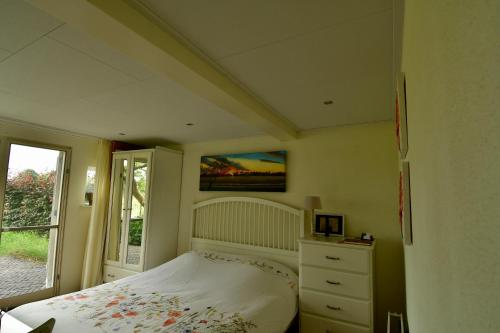 Un pat sau paturi într-o cameră la De Veldeling