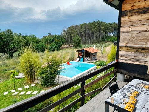 an overhead view of a swimming pool on a deck at Casa das Aveleiras - Sátão in Sátão