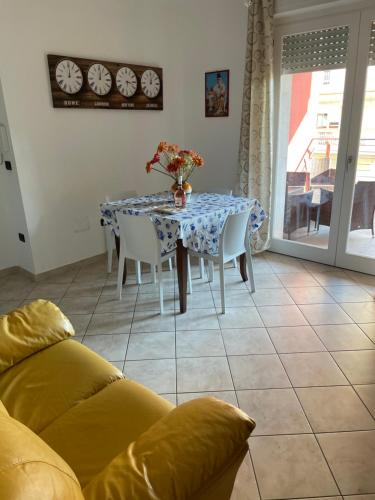 a dining room table with a blue and white table cloth at Casa Vacanze dell'aviatore in Alghero