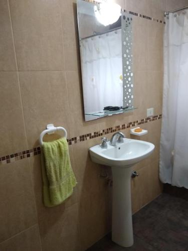 a bathroom with a sink and a mirror at Casa Centrica Lujan Planta Alta in Luján