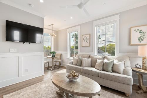 a living room with a couch and a table at The Magnolia Suite at 124 Spring in Charleston