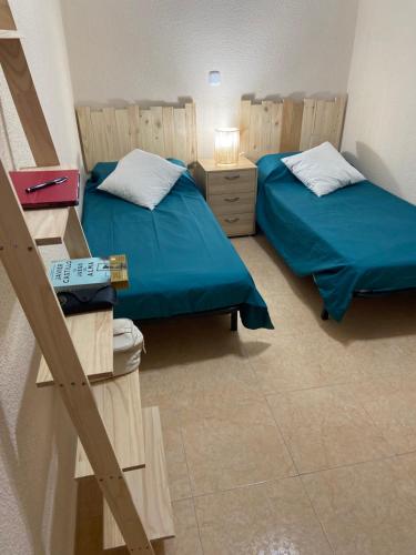 מיטה או מיטות בחדר ב-El rincón de Siete Picos