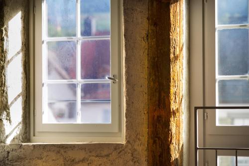 an open window in a room with at Gasthaus zum Trauben in Weinfelden