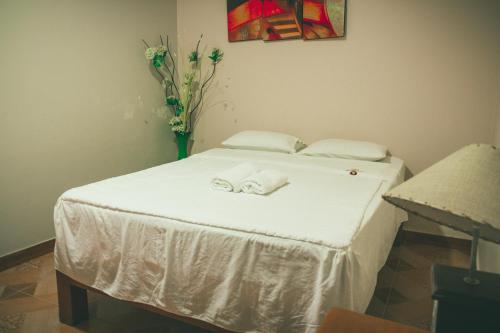 Ліжко або ліжка в номері Hotel Leal