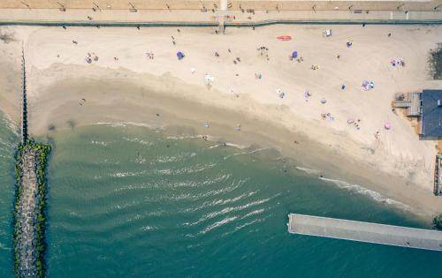 an aerial view of a beach and the water at The Lucky Beach House, The Most Popular Beach House in Atlantic City! WOW! in Atlantic City