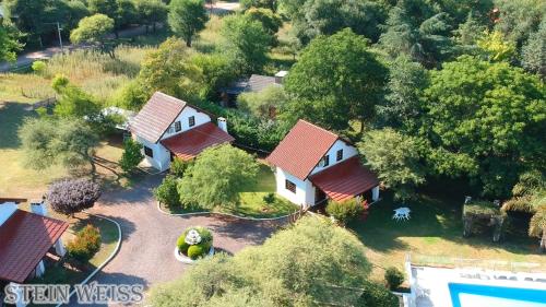 an overhead view of a house with red roofs at Cabañas Stein Weiss in Santa Rosa de Calamuchita