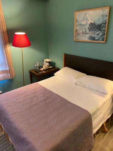 Postel nebo postele na pokoji v ubytování Rodmay Hotel