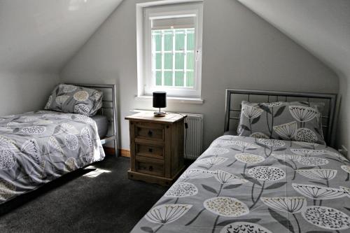 Postel nebo postele na pokoji v ubytování Aunt Rachel's Cottages-McAllister's Cottage