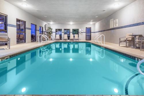 a swimming pool in a hotel room with at Holiday Inn Express Hotel & Suites Austin NE-Hutto by IHG in Hutto